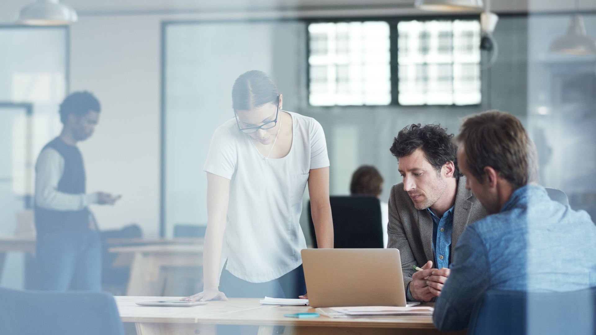 A group of charity professionals discussing the prospect of empowering non-profit organisations with Microsoft Azure