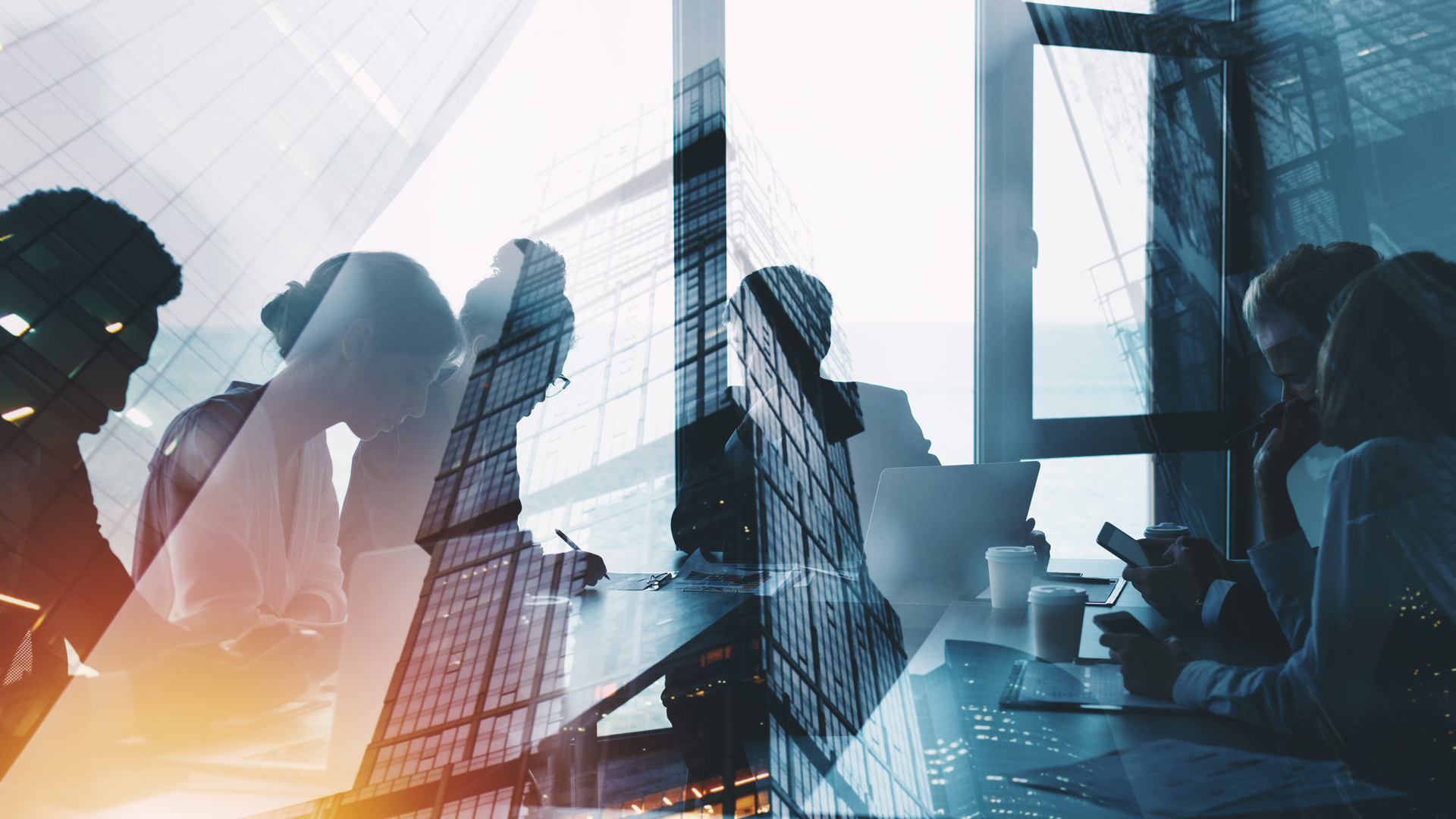 Montage of corporate businesspeople in discussion about how to Transform your Cloud strategy with serverless computing