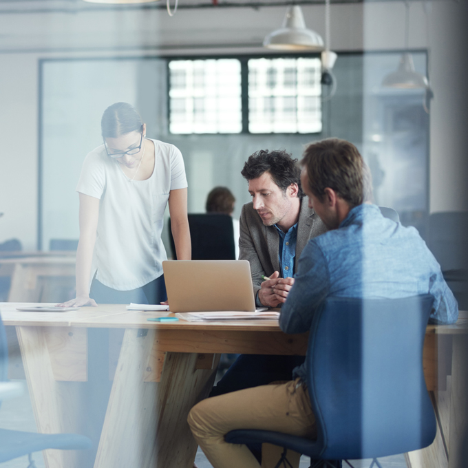 A group of charity professionals discussing the prospect of empowering non-profit organisations with Microsoft Azure